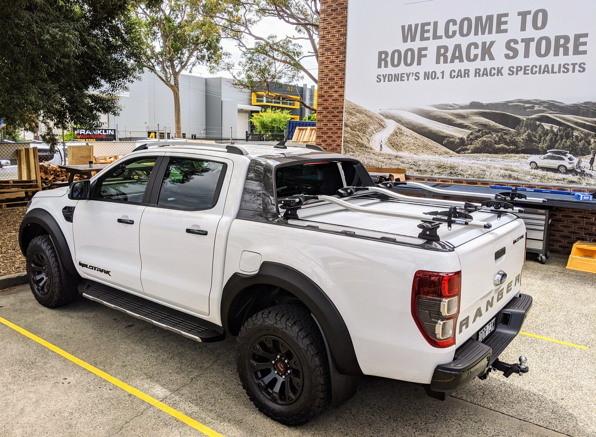 Ford Ranger WildTrak With Twin Thule Outride 561 Bike Carriers On Rhino-Rack Cargo Tub Rack