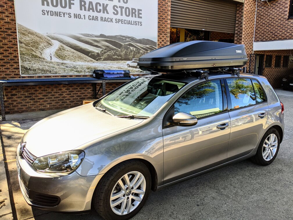 VW Golf Mk7 With Thule Touring 780 Roof Box On Whispbar Roof Rack