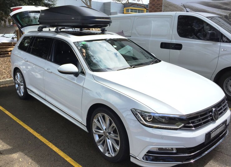 VW Passat Wagon With Thule Touring 780 Roof Box On Thule Evo Roof Rack